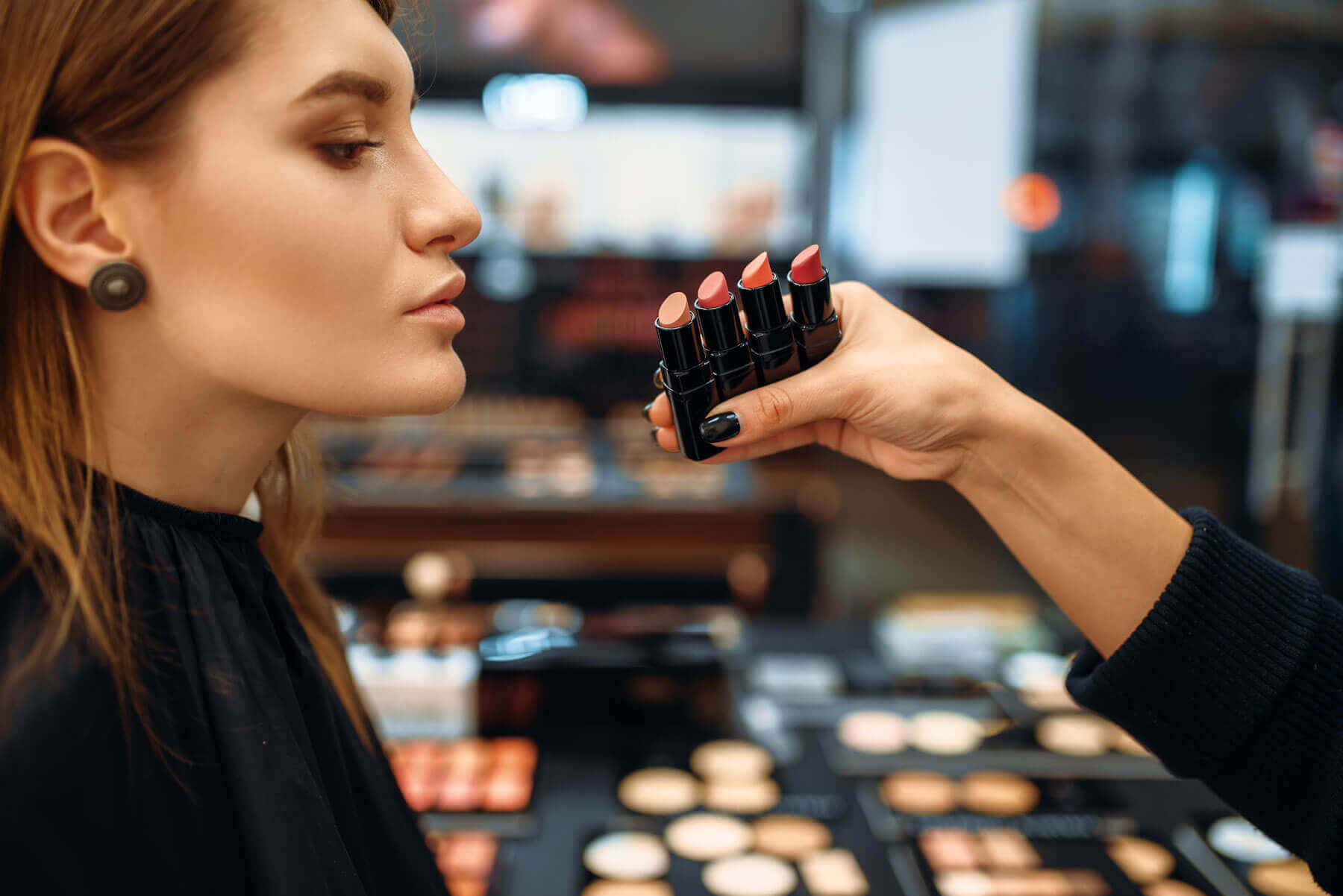 beauty-shopper-chooses-lipstick-makeup-shop-2022